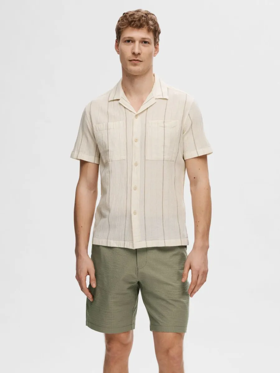 bomullssydd_kortrmad_skjo_0-2.webp SELECTED BOMULLSSYDD KORTÄRMAD SKJORTA Beige Shop