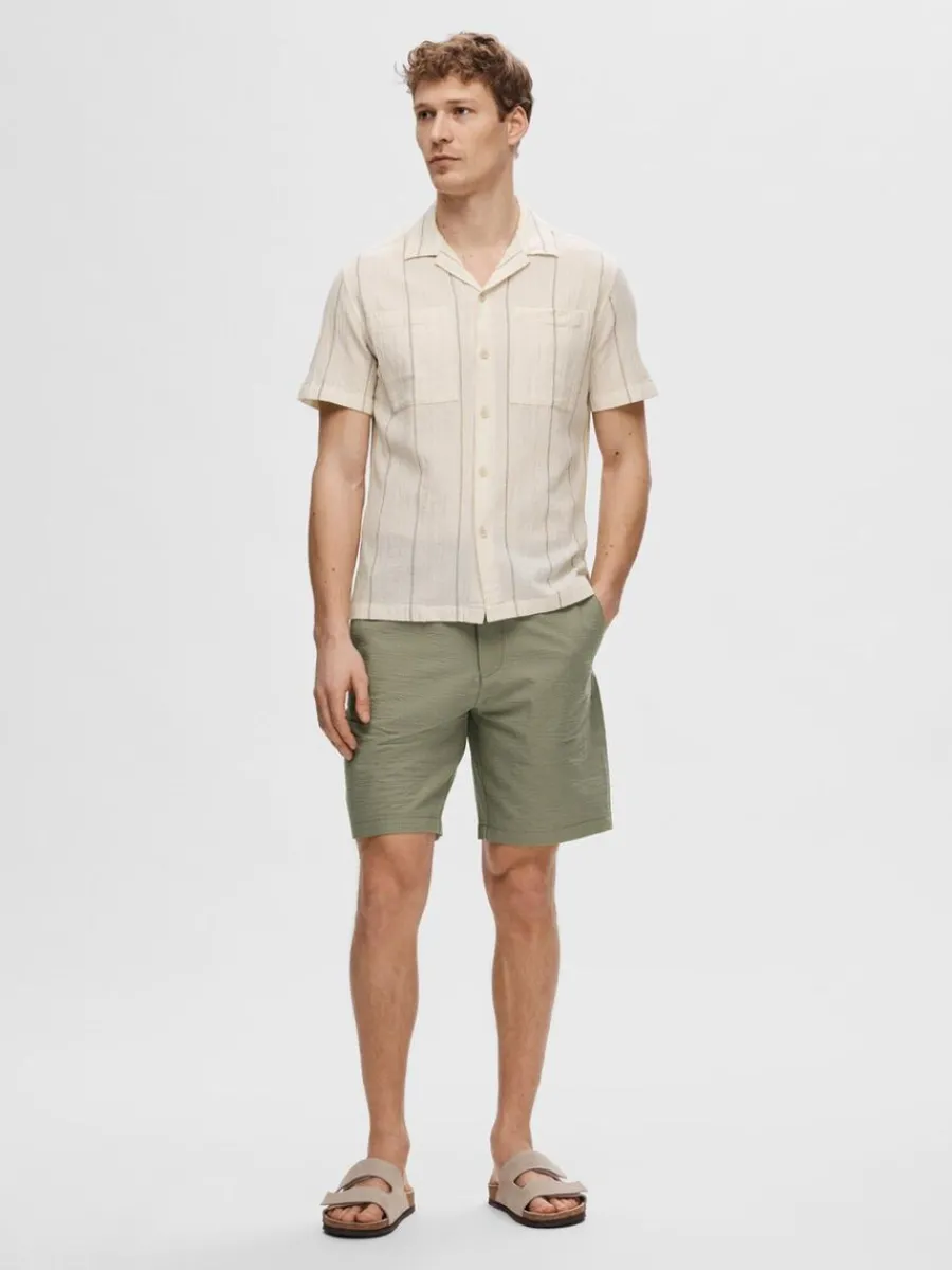 bomullssydd_kortrmad_skjo_2-2.webp SELECTED BOMULLSSYDD KORTÄRMAD SKJORTA Beige Shop