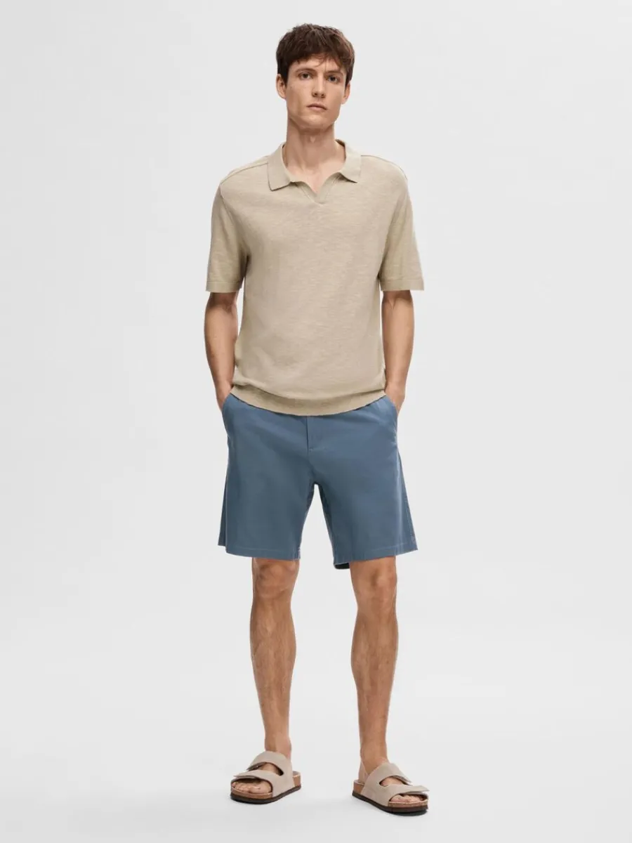 kortrmad_stickad_piktrja_1-1.webp SELECTED KORTÄRMAD STICKAD PIKÉTRÖJA Beige Store